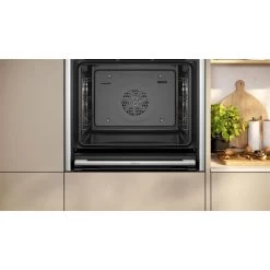 Neff N70 B54CR31N0B Bulit In Single Slide & Hide Electric Oven With Home Connect - Black With Steel Trim -Kitchen Sale Shop n e neff n70 b54cr31n0b slide and hide electric oven lifestyle2